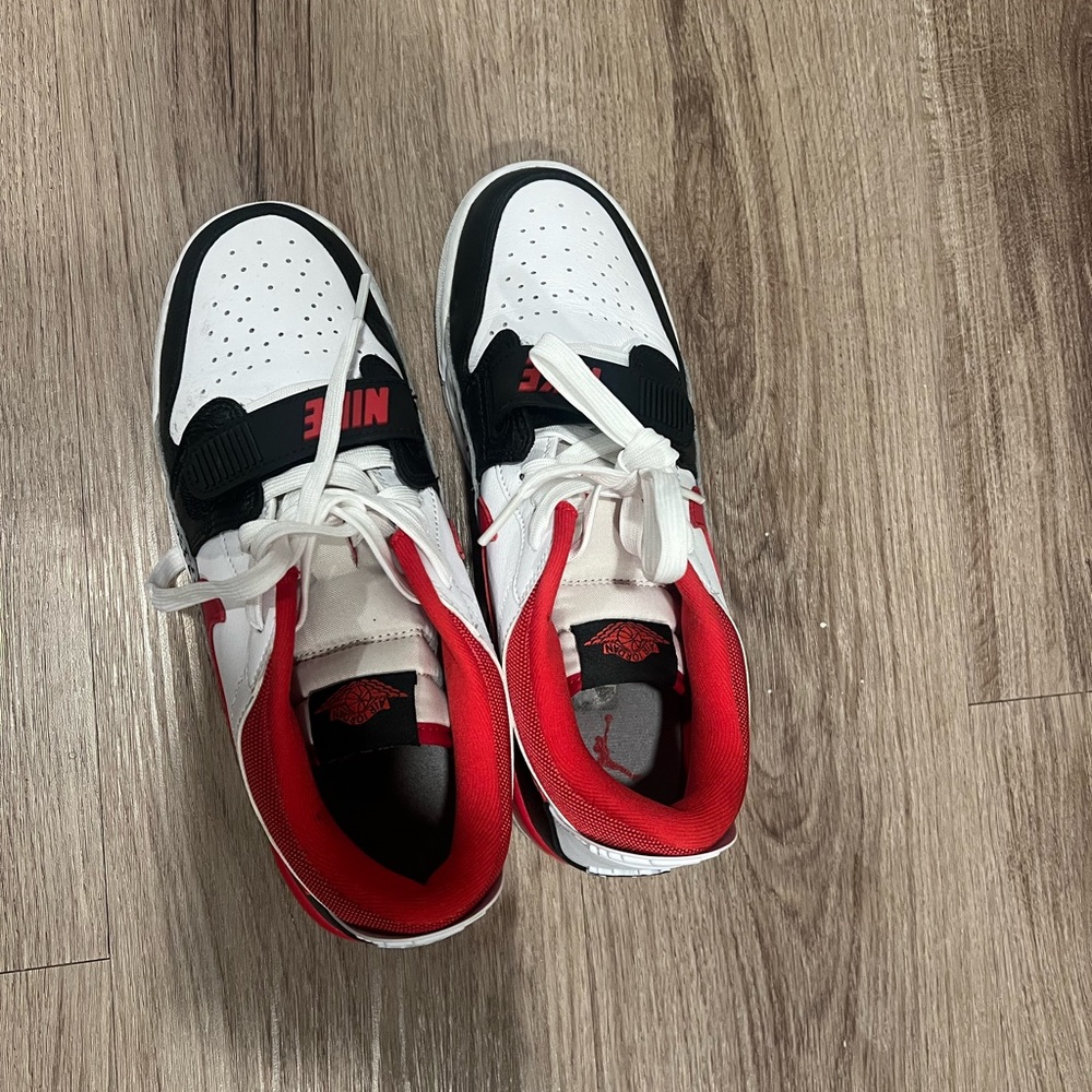 Red, black, and white jordans